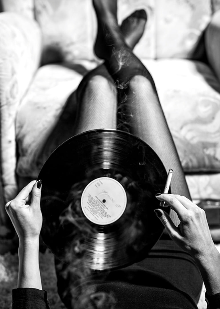 Poster with a vintage black and white photograph of a woman holding a vinyl record-12
