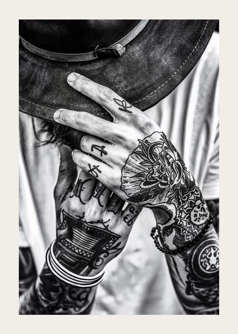 Poster from the photo art category with a black and white photograph of a man with tattooed hands-12