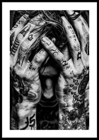 Black and white poster with a photograph of a man with his face hidden in his tattooed hands-2