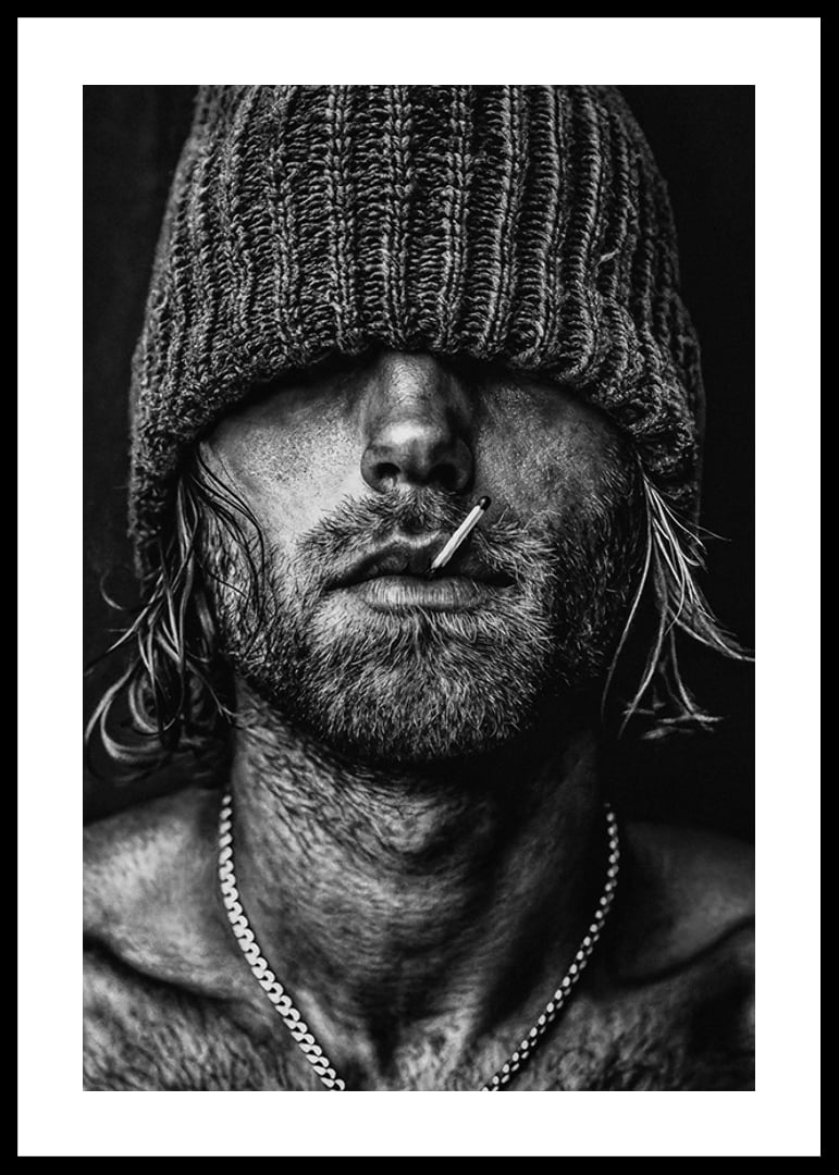 Black and white poster with a photograph of a man with a cap pulled down over his eyes-12