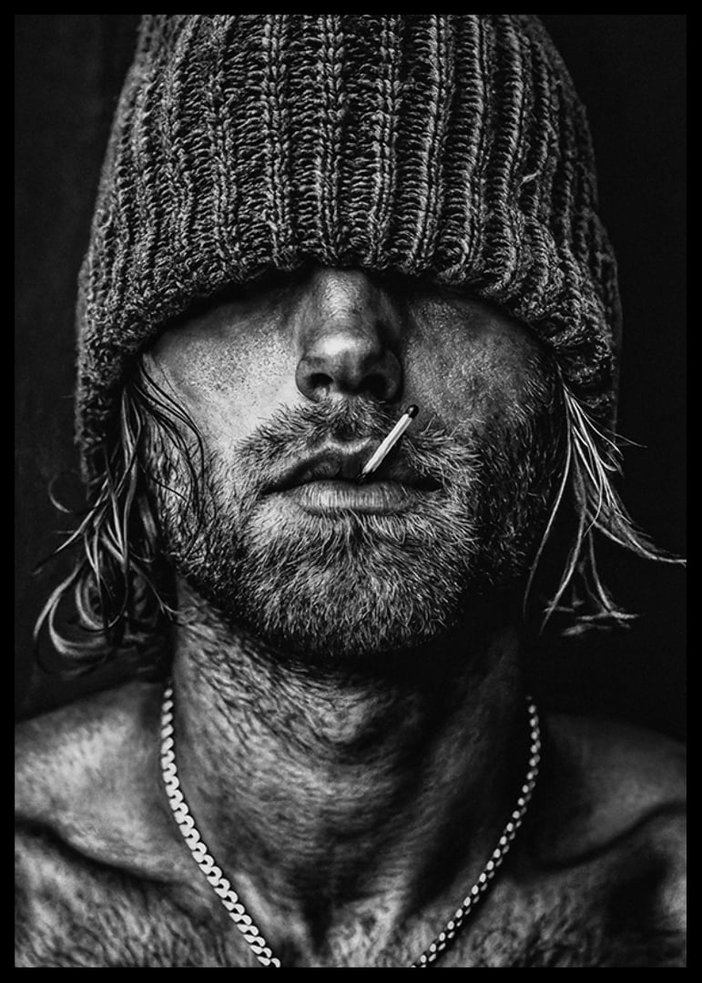 Black and white poster with a photograph of a man with a cap pulled down over his eyes-12