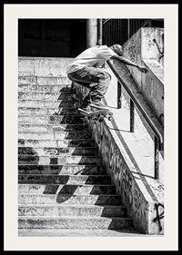 Black and white poster with a photograph of a skateboarder jumping down a flight of stairs-2
