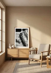 Black and white poster with a photograph of a skateboarder jumping down a flight of stairs-8
