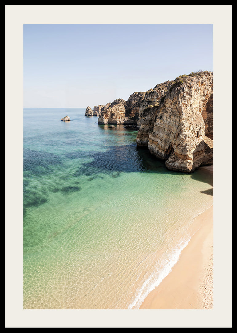 Poster with an image of a deserted beach and a crystal clear sea by a cliff-12