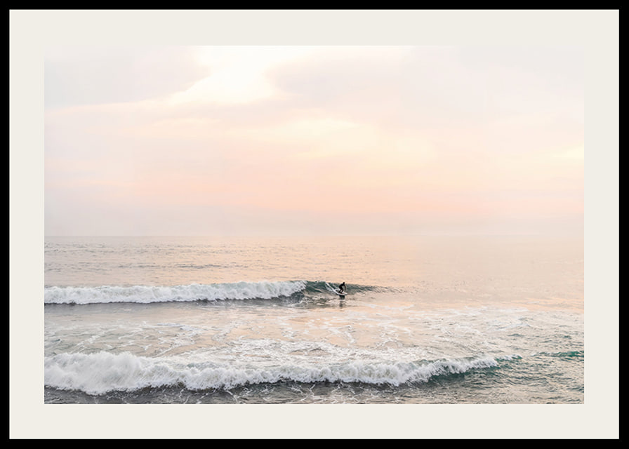 Poster with a photograph of a lone surfer at sea among the waves-12