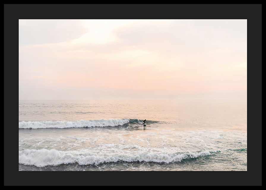 Poster with a photograph of a lone surfer at sea among the waves-12