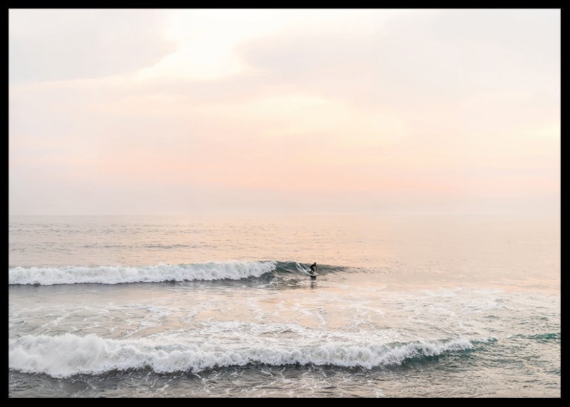 Poster with a photograph of a lone surfer at sea among the waves-12