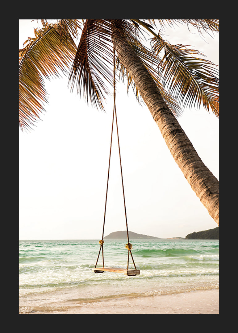 Poster with a photograph of a swing hanging from a palm tree on a beach-12