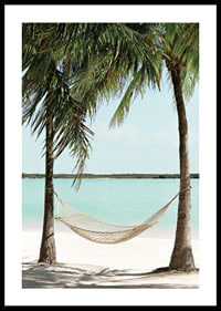 Poster with a photograph of a hammock between two palm trees on a beautiful beach-0