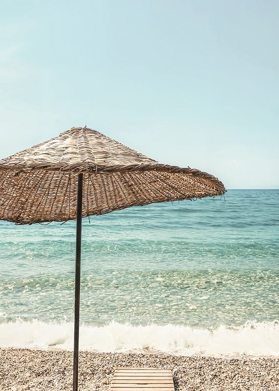 Poster with a photograph of a beautiful parasol by a beach-12