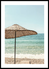 Poster with a photograph of a beautiful parasol by a beach-0