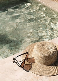 Poster with a photograph with a summer feel on a hat by a pool-7