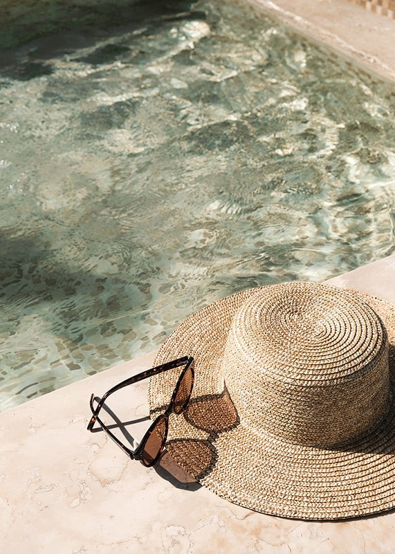 Poster with a photograph with a summer feel on a hat by a pool-12