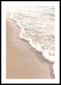 Poster with a photograph that captures the soft waves of the sea rolling in over the golden sand.-0