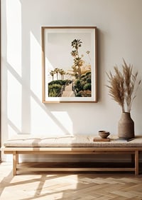 Poster with a photograph of palm trees and sea bathed in a golden light.-8