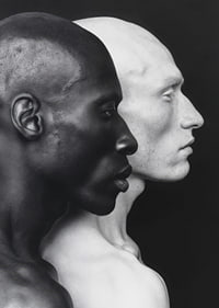 Poster with a photograph of a black and a white man symbolizing unity and difference-7