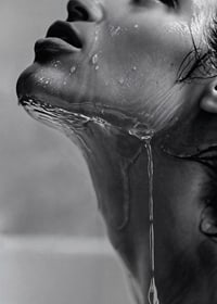 Black and white poster with a sensual photograph of a model with running water-7