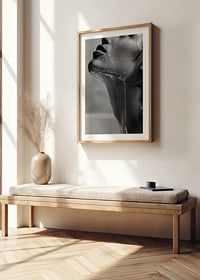 Black and white poster with a sensual photograph of a model with running water-8