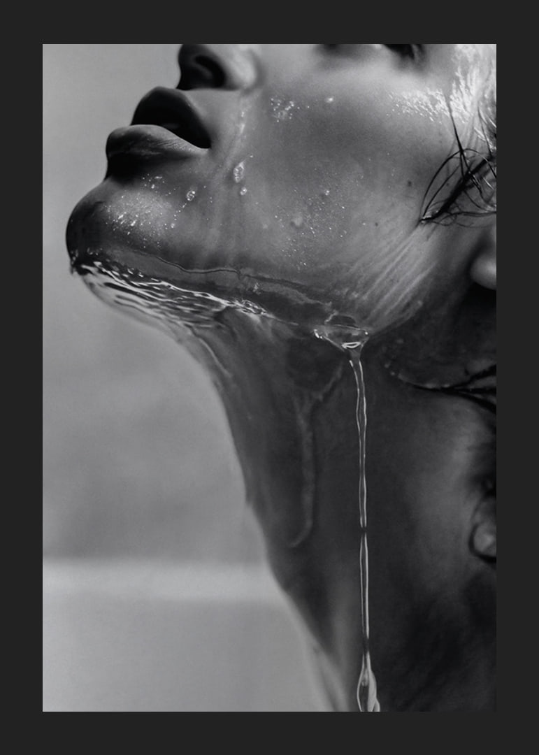 Black and white poster with a sensual photograph of a model with running water-12