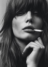 Black and white poster with a photograph of a young model with attitude-7