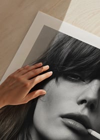 Black and white poster with a photograph of a young model with attitude-9