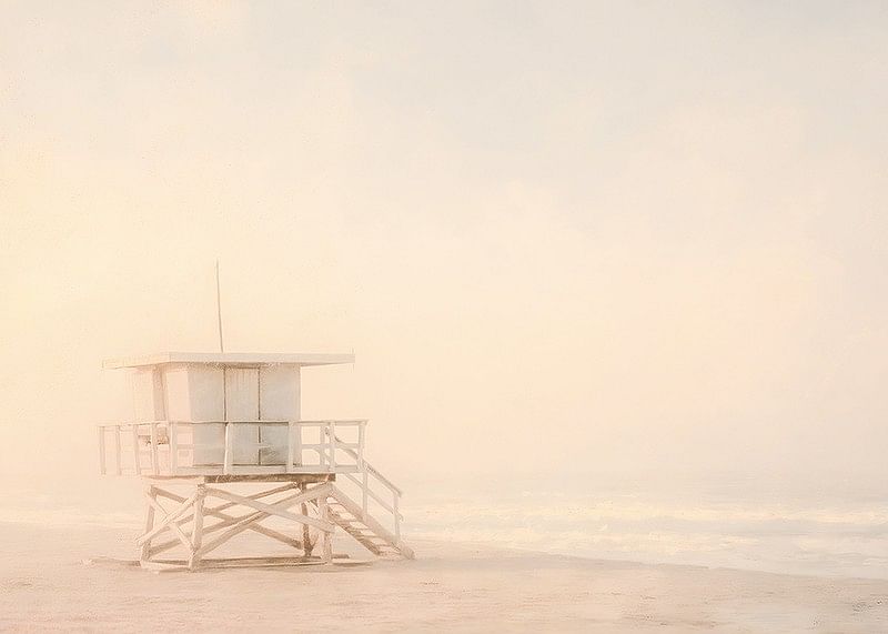 A poster of a lonely lifeguard tower wrapped in soft sea fog-12