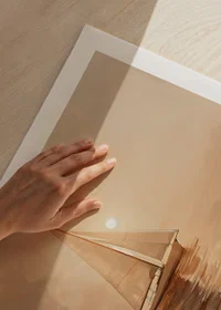A poster of a sailboat gliding through the Pacific Ocean in golden morning light-9