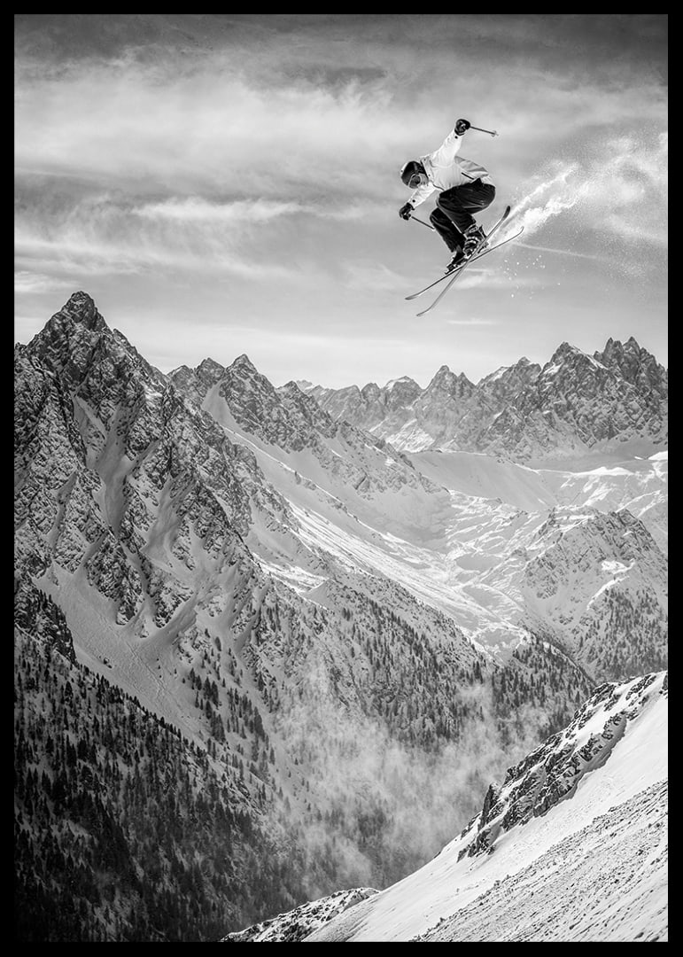 Poster where a skier goes down the mountain-12