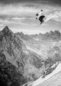 Poster where a skier goes down the mountain-7