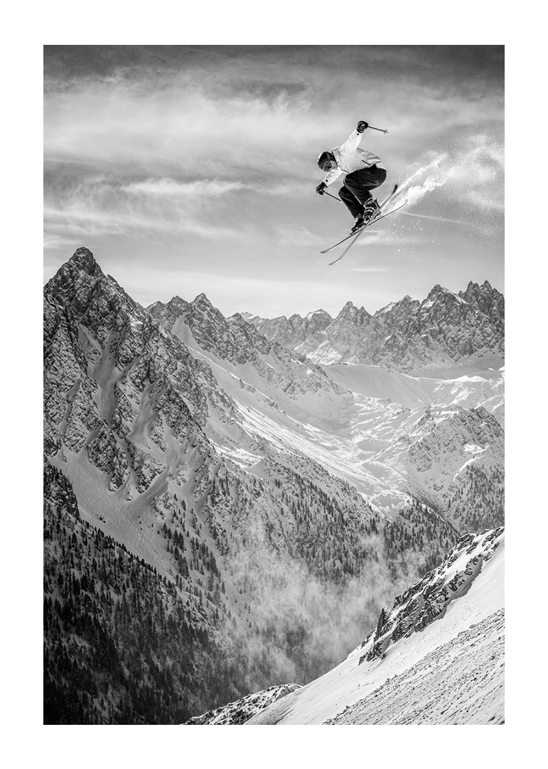 Poster where a skier goes down the mountain-12