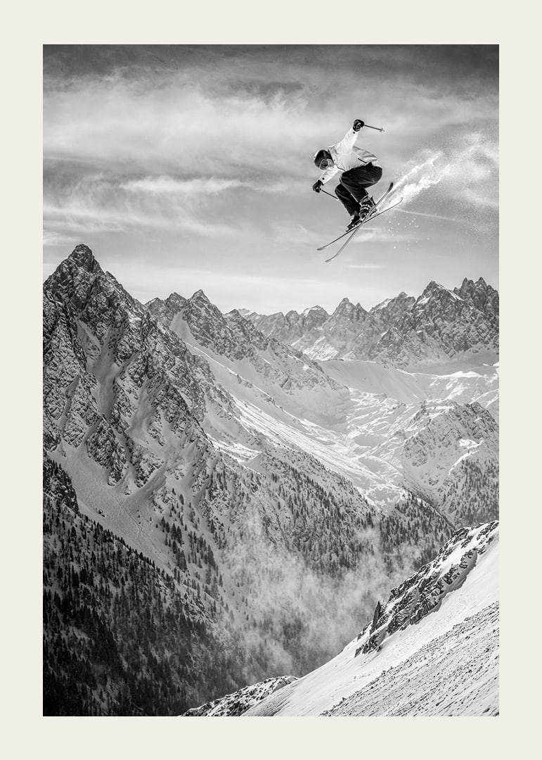 Poster where a skier goes down the mountain-12