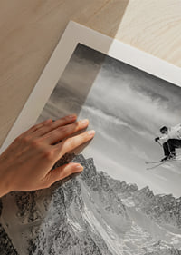 Poster where a skier goes down the mountain-9