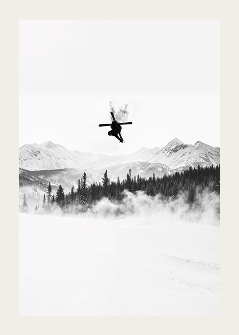 Poster of a skier in the Alps jumping between treetops-12