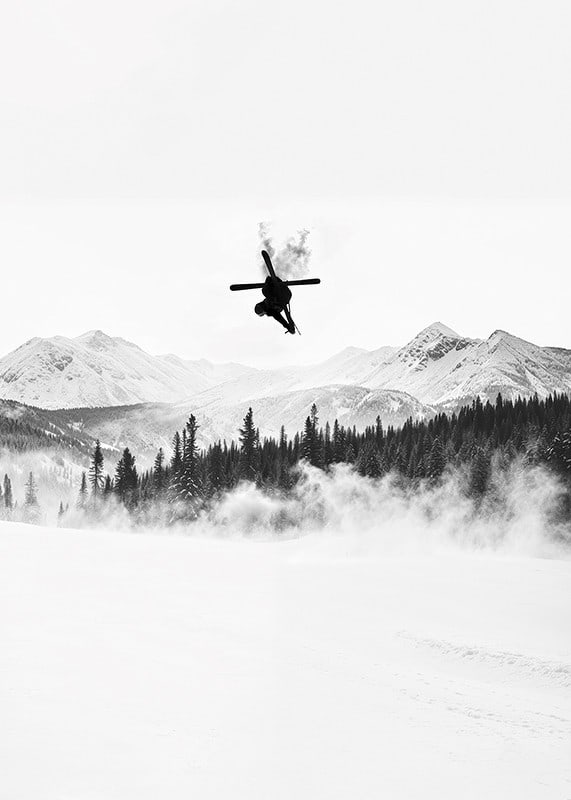 Poster of a skier in the Alps jumping between treetops-12