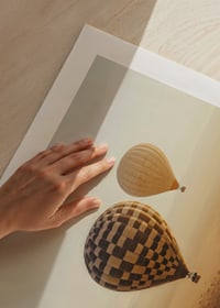 Poster with hot air balloons floating over a beautiful desert-9