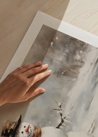 A poster showing a playful snowman in a sparkling winter landscape-9