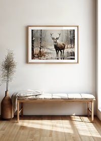 A poster depicting a majestic deer in a peaceful snow-covered forest-8