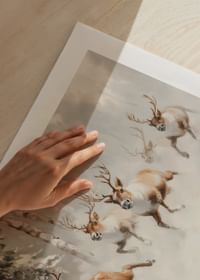 A poster that captures the majestic gallop of reindeer through a snow-covered forest-5