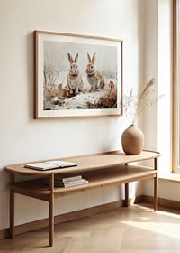 Een poster die de serene aanwezigheid van twee konijnen in een winters landschap vastlegt-8