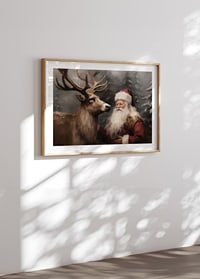 A poster capturing Santa's warm bond with a reindeer in a wintry landscape-8
