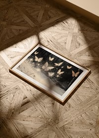 A poster of luminous butterflies hovering over a snow-covered landscape, lighting up the winter night.-8