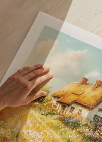 A poster depicting a charming cottage surrounded by blooming meadows-9