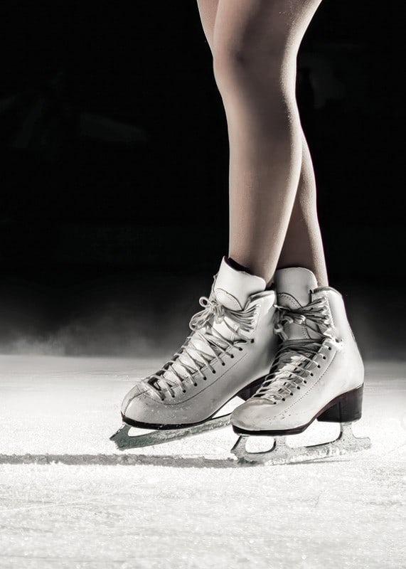 A pair of elegant figure skates stand poised on the ice, ready to create magic with every move-12