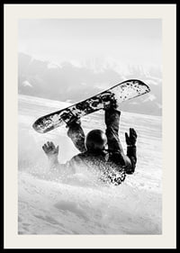 A dramatic moment of snowboarding adventure where a skier meets both speed and fall in snow-covered mountains.-2