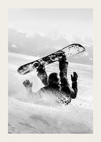 A dramatic moment of snowboarding adventure where a skier meets both speed and fall in snow-covered mountains.-3