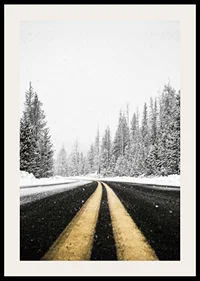 A desolate winter road winds through a snow-covered forest-2