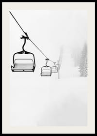 An empty ski lift stretches through a snow-covered landscape, capturing the quiet and peaceful beauty of winter-2
