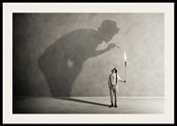 A symbolic image of facing one's inner demons, where a small torch casts a large, confrontational shadow-2