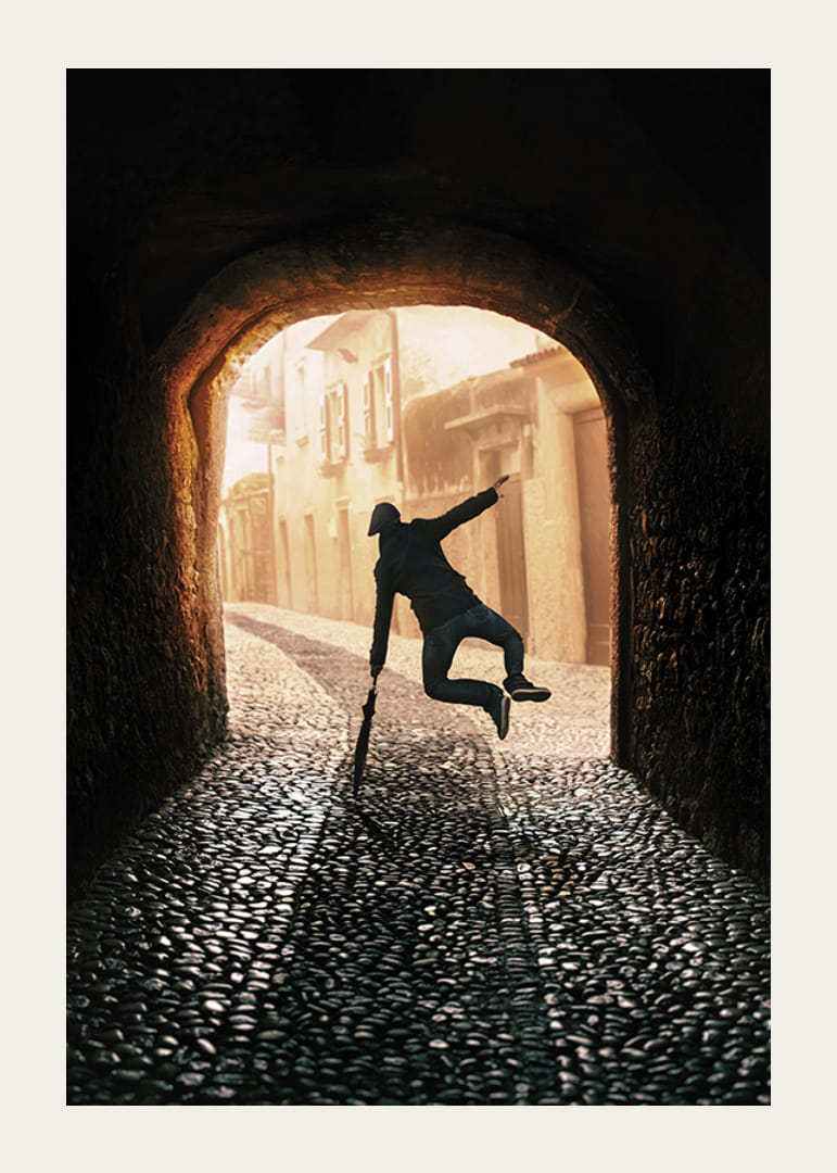 An energetic scene where a person jumps towards the light in an old, stone-paved alley-12