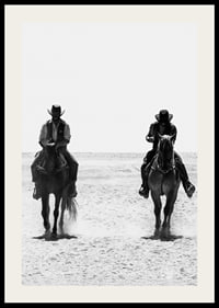 Two cowboys ride side by side through a desolate landscape, framed by the timeless mystery and freedom of the Wild West.-2
